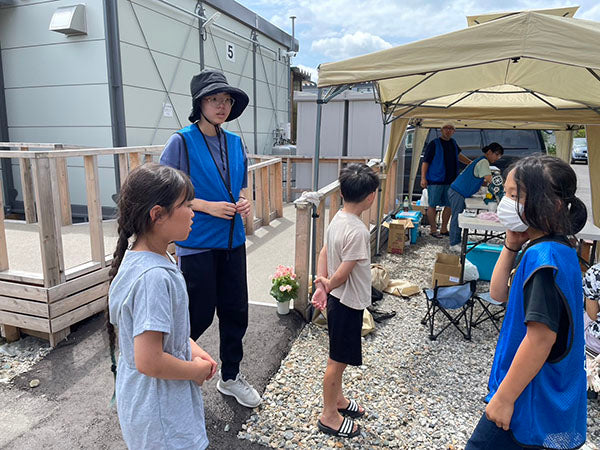 七尾市の仮設住宅へ花の鉢植えをお届けしました